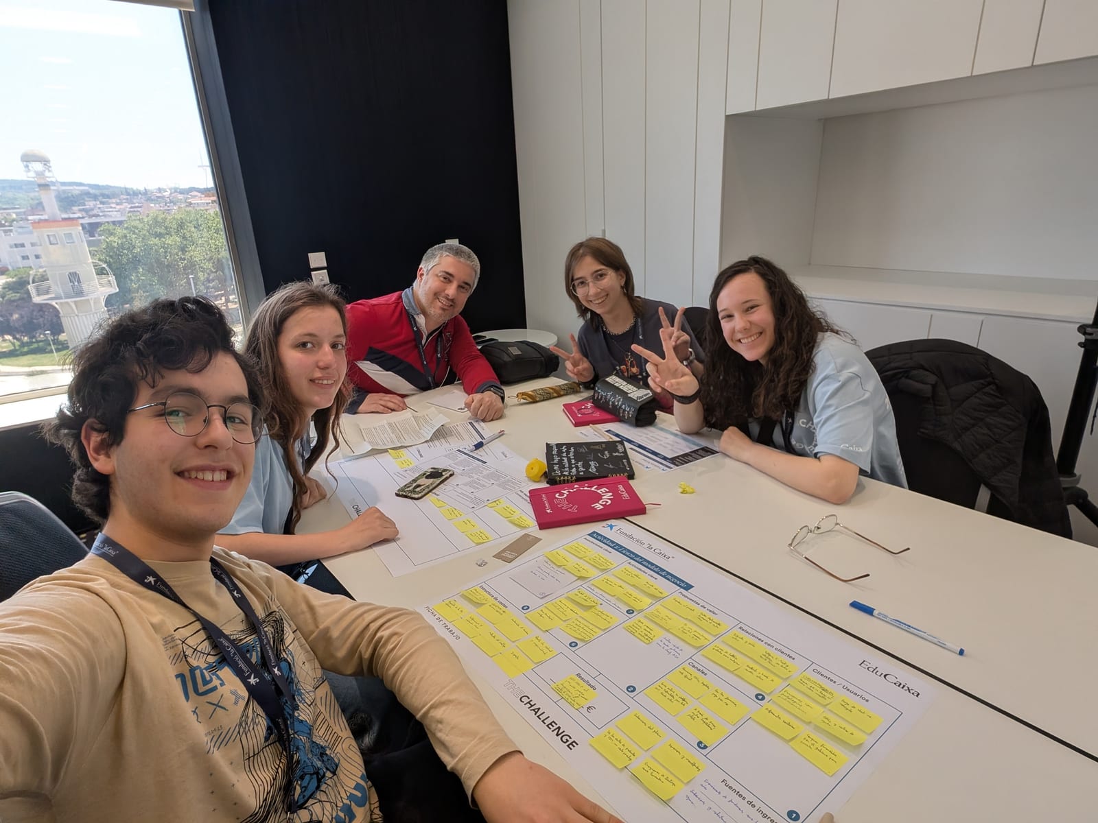 The SoundChestAI team poses together with their teacher indoors at The Challenge 2025.