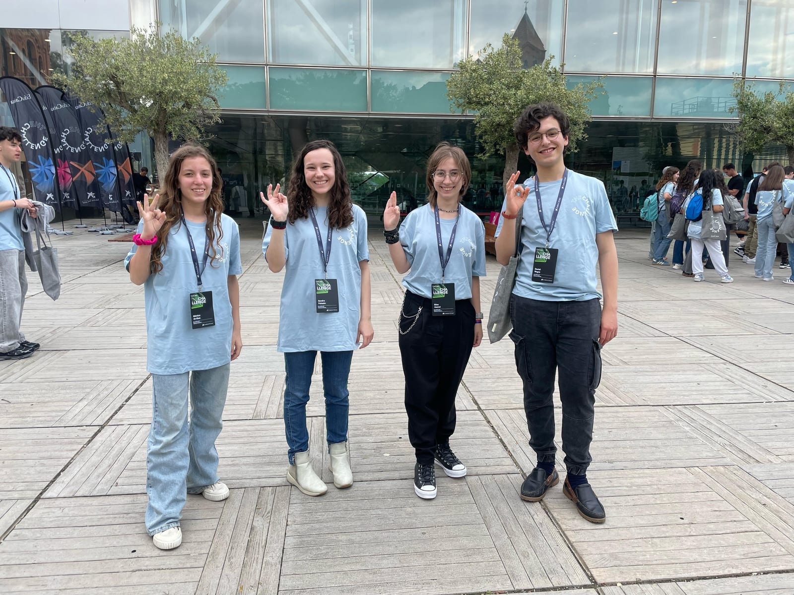 The Challenge 2025 SoundChestAI team poses outside the venue in matching shirts.